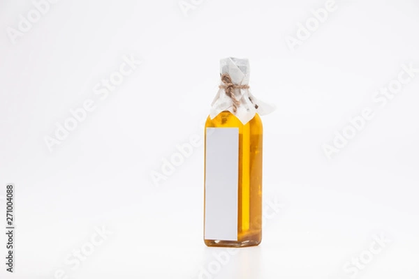 Fototapeta Perill oil in single glass bottle on white background