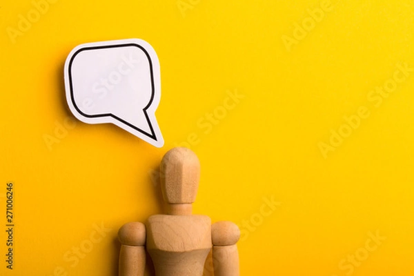 Fototapeta Thinking Concept With Blank Speech Bubble And Wooden Man