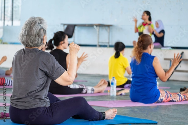 Fototapeta Elderly in a yoga exercise posture