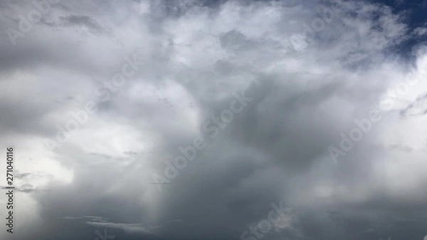 Obraz Epic gloomy storm clouds moving fast over dark blue sky background. 4K