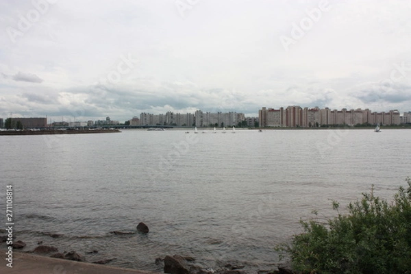 Fototapeta a view of the river, boats and buildings  