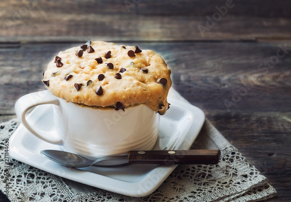 Fototapeta Cake in mug with peanut butter and chocolate chips