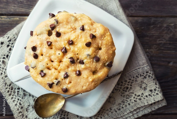 Fototapeta Cake in mug with peanut butter and chocolate chips