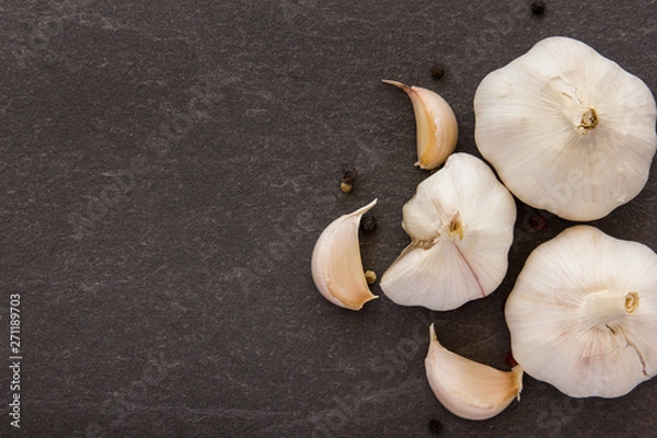 Fototapeta Garlic on black background