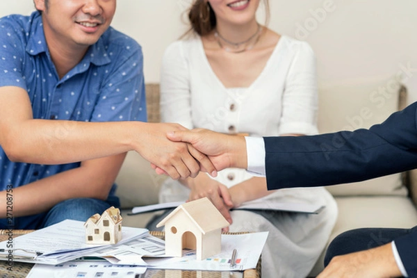 Obraz Close up, Man shaking hands represent sale, Asian couple meeting financial adviser for home, real estate purchase, success business contract deals with sale. Success deals.