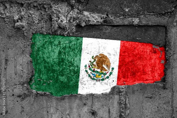 Fototapeta The flag of Mexico on a dirty wooden surface, built into a concrete base, with scuffs and scratches. Loss or destruction conception.