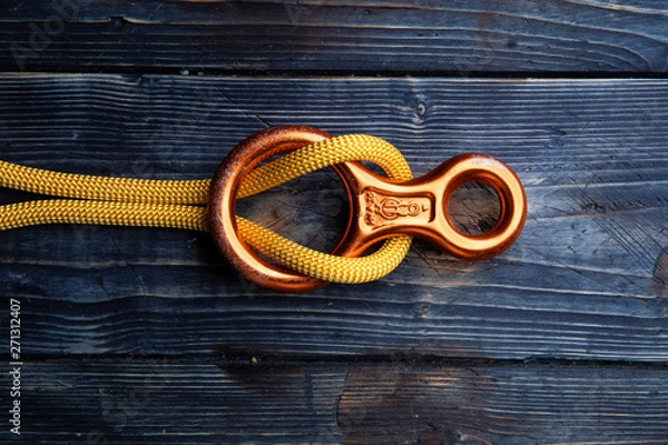 Obraz Close up of climbing gear on wooden desk - table top shot