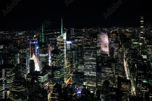 Fototapeta aerial night panorama of new york manhattan with glowing times square - top view