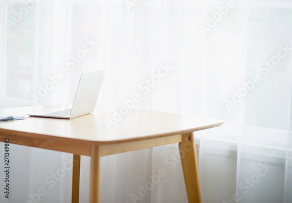 Fototapeta Desk and beautiful computer There is a light shining through the window in the morning - picture