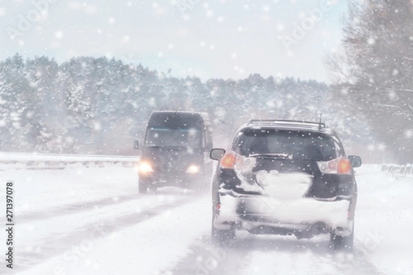 Obraz Driving in snow storm on bad winter Road