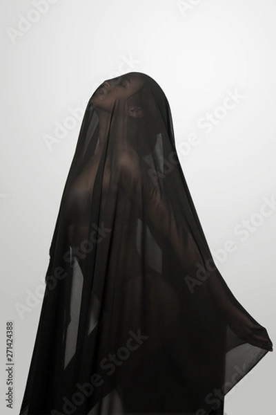 Obraz Girl in a black transparent veil on the face. Conceptual portrait in the studio. Minimalism.