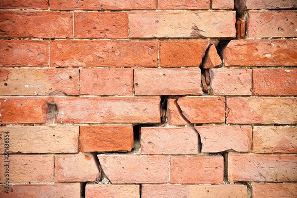 Fototapeta Deep crack in old brick wall - concept image