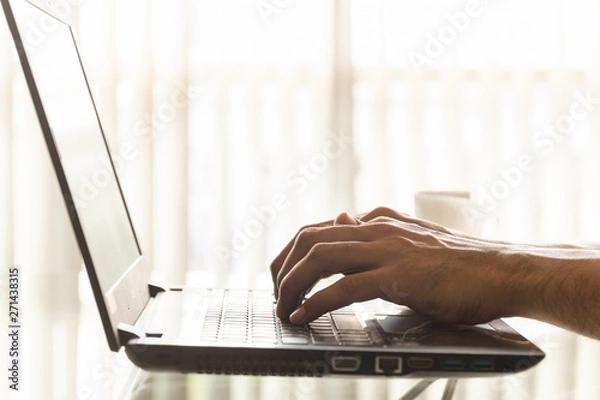 Obraz Close-up hands of businessmen are using laptops in the office.