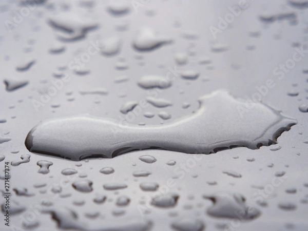 Obraz Close up of water droplets on grey car.
