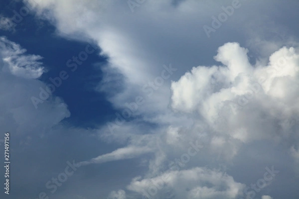 Obraz A huge cumulus and cumulonimbus clouds on the blue sky background