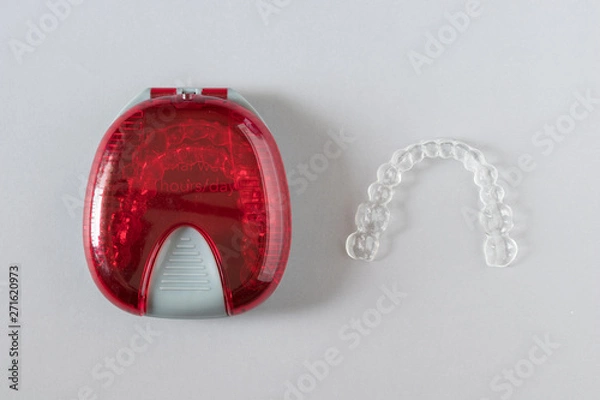 Obraz Top view of invisalign braces or invisible retainers on grey background, new orthodontic equipment
