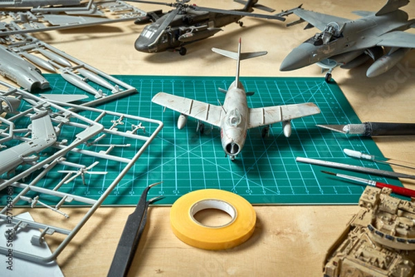 Obraz Top view on plastic model scale with accessories on  green pad on  wooden table
