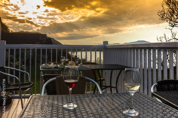Obraz Drinking wine during beautiful sunset at Loch Linnhe in Kentallen. Argyll and Bute, Scotland, United Kingdom