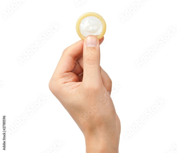 Obraz Condom in hand isolated on white