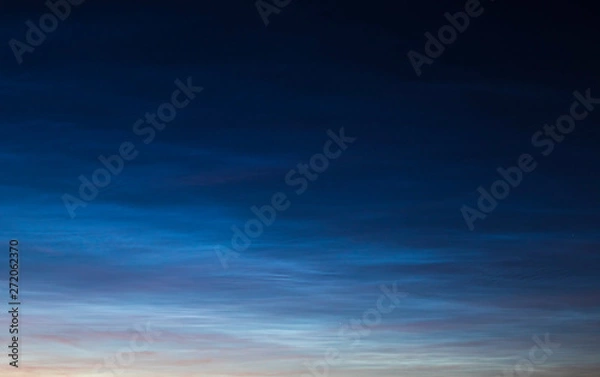 Obraz Noctilucent clouds on sunset.