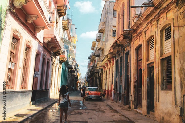 Fototapeta Colorful street and old car in Havana, Cuba