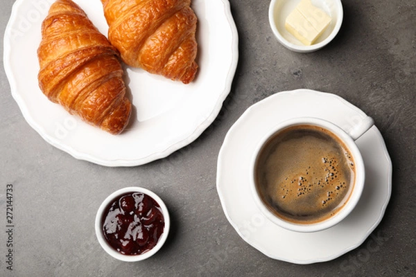 Fototapeta Flat lay composition with cup of coffee and croissants on grey background