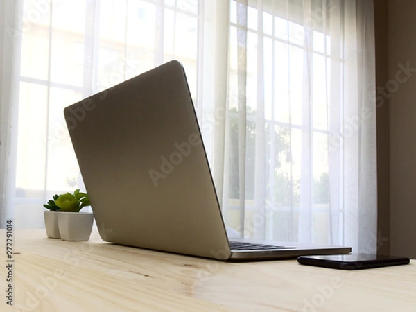 Fototapeta Desktop mockup with laptop and mobile phone