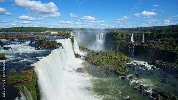 Obraz Iguazu Falls and rainbow on the Iguacu River. Located between Argentina and Brazil. Largest waterfalls system in the world.