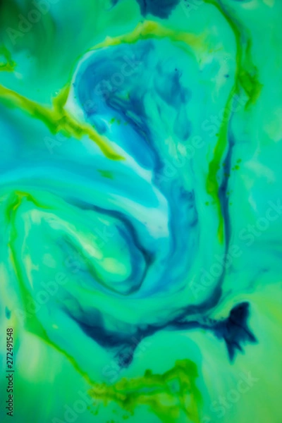 Fototapeta Blue and Green Wispy Color on Water Soft, gentle, relaxing swirls. Flowing colors draw you in and calm you.