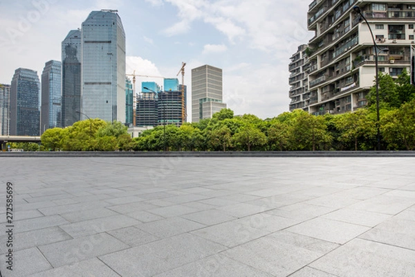 Fototapeta Panoramic skyline and modern business office buildings with empty road,empty concrete square floor