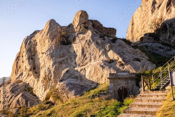 Fototapeta Ruins of Castelmezzano castle and gate of water reservoir. Dolomites of Basilicata mountains called Dolomiti Lucane. Basilicata region, Italy