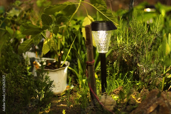 Obraz Beautiful lamp in the garden. Lamp with solar battery