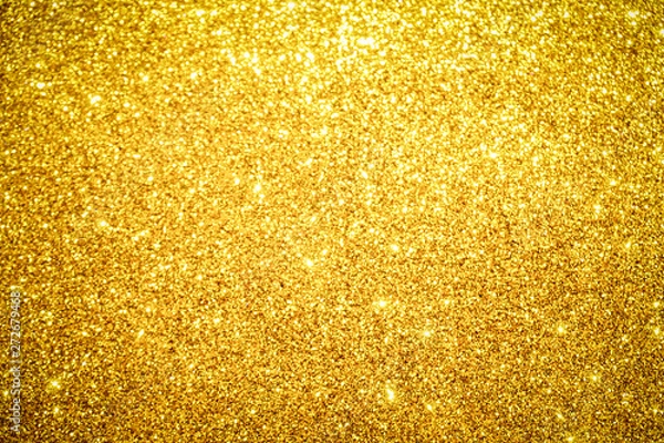 Fototapeta gold Sparkling Lights Festive background with texture. Abstract Christmas twinkled bright bokeh defocused and Falling stars. Winter Card or invitation