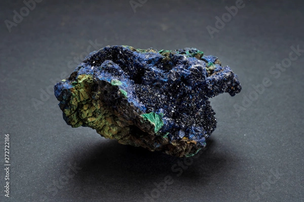 Fototapeta Piece of Azurite mineral from Bolivia. A soft, deep blue copper mineral produced by weathering of copper ore deposits.