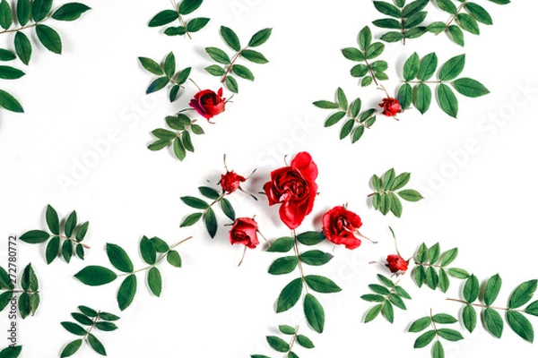 Obraz Floral pattern made of red roses, green leaves, branches on white background. Flat lay, top view. Nature background. Pattern of flowers. Flowers pattern texture