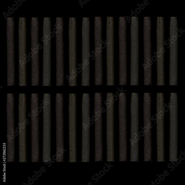 Fototapeta Cigars on a dark background. Cigars in the dark. Background of evenly spaced cigars.