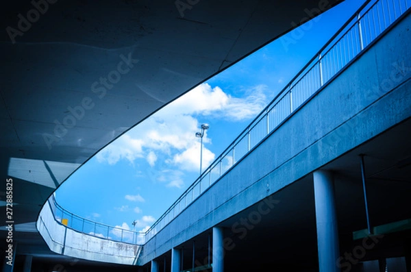 Obraz modern office building with blue sky and clouds