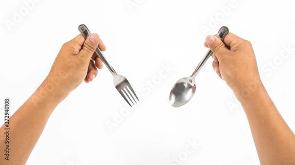 Fototapeta hands hold folk and spoon on white background