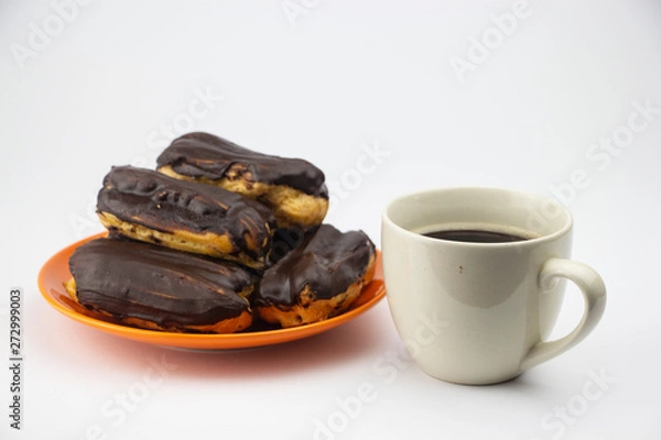Obraz Chocolate eclairs with hot coffee