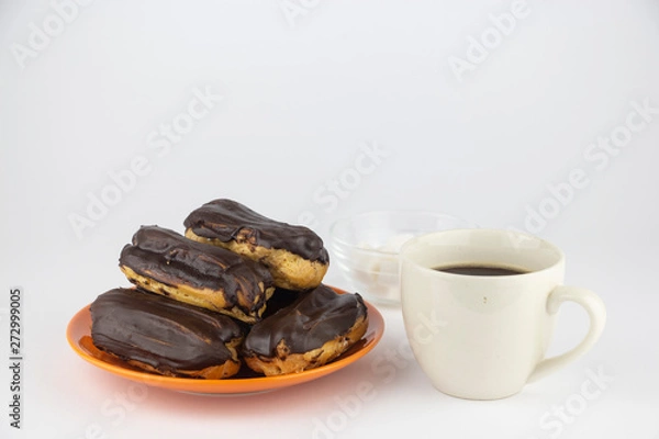 Obraz Chocolate eclairs with hot coffee