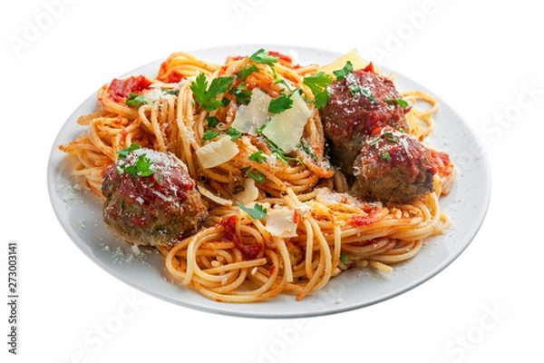 Obraz Pasta with meatballs, parmesan and tomato sauce on a white plate. Homemade Italian spaghetti isolated on white background.