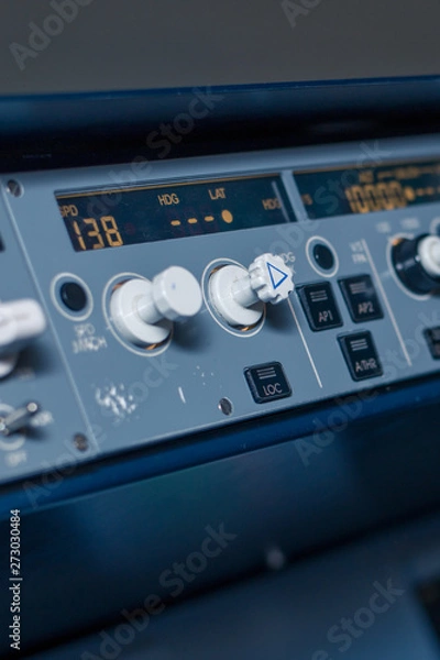 Obraz Toggle switches and sensors on the dashboard in the cabin of passenger plane