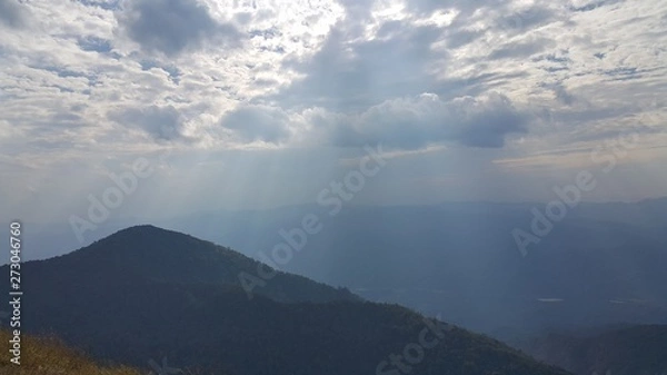 Obraz clouds and sunset over the mountains
