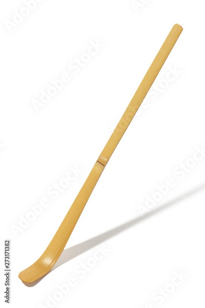 Fototapeta Closeup shot of chashaku bamboo scoop for dishing out Matcha powder, isolated against snow-white background. Essential and traditional Japanese tea ceremony accessory. Authentic matcha making tool.