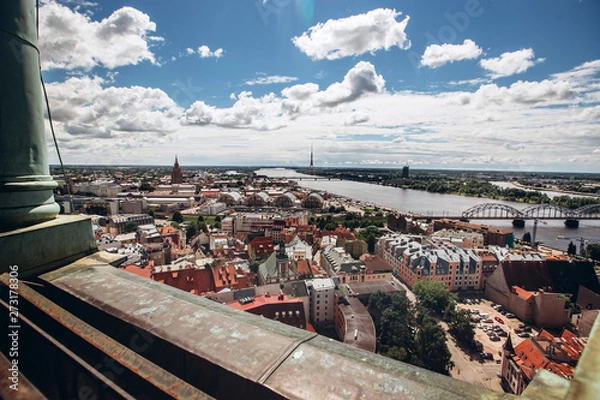 Fototapeta Red roofs of old Riga. Riga cityscape on a sunny summer day. City aerial view of the old town with the Dome Cathedral and the Daugava River in the city of Riga, Latvia