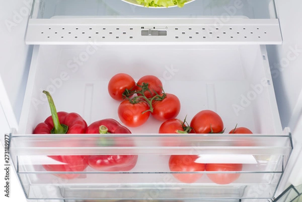 Obraz Open fridge full of fresh fruits and vegetables