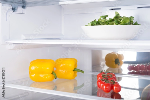 Obraz Open fridge full of fresh fruits and vegetables