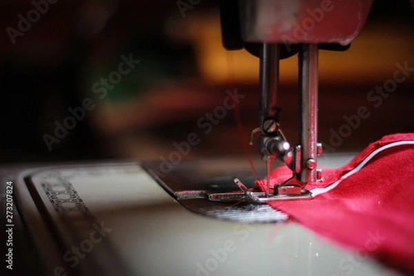 Fototapeta sewing machine with red thread and needle