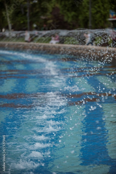 Fototapeta Water fountain on a sunny day at Union Square in Bucharest City