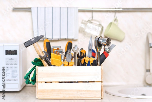 Fototapeta construction tools in wooden box in kitchen